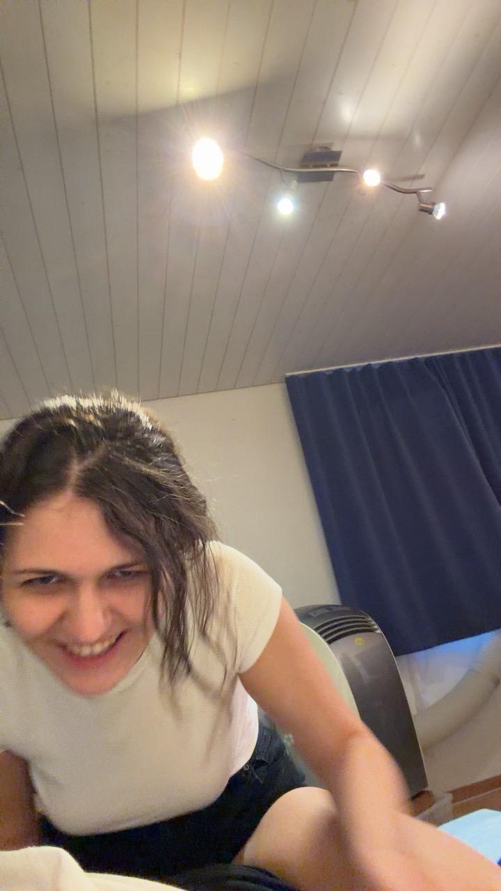 Asya grinning mid movement