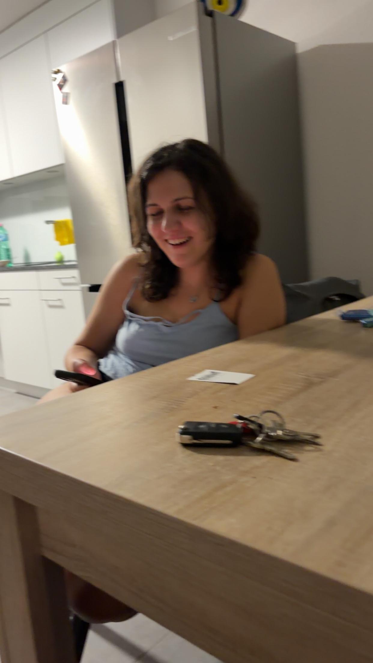 Asya laughing at the kitchen counter